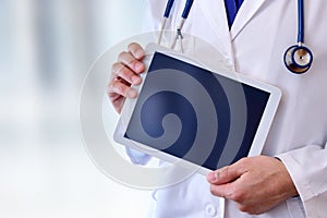 Doctor with tablet health and technology concept