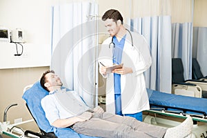 Doctor taking care of patient in hospital