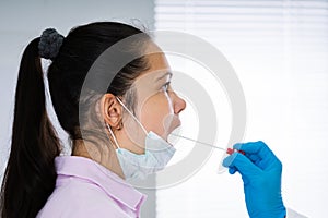 Doctor Taking Mouth Fluid Swab Sample