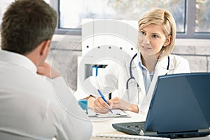 Doctor taking notes about patient