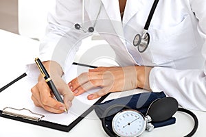 Doctor taking notes about patient