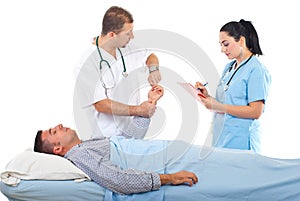 Doctor taking patient pulse