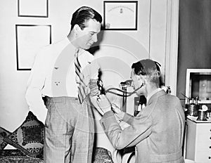 Doctor taking a patients blood pressure