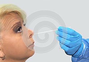 Doctor taking PCR test to patient, beautiful woman