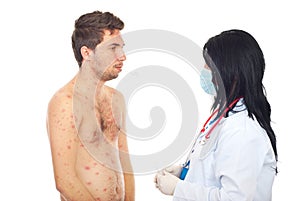 Doctor taking temperature to sick male