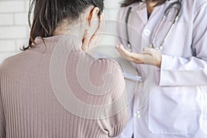 Doctor talking and explaining the treatment result to female patient