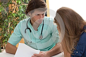 Doctor talking with hypochondriac photo