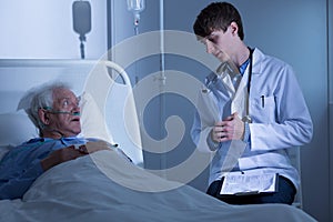 Doctor talking with ill man