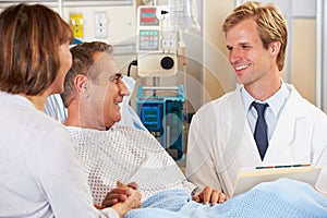 Doctor Talking To Couple On Ward