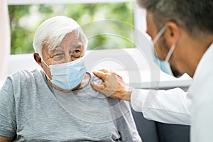 Doctor Talking To Elderly Patient