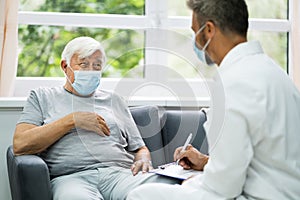 Doctor Talking To Elderly Patient