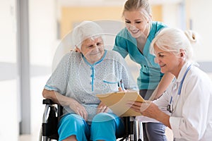 Doctor talking to her patient in hospital