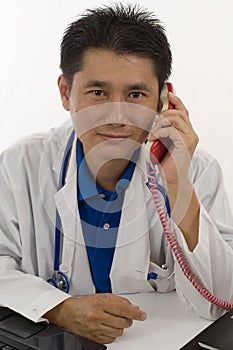 Doctor talking to patient on the telephone