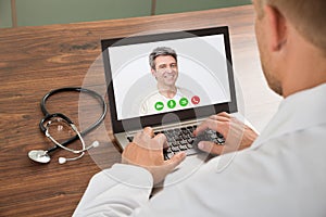 Doctor talking to patient through video chat