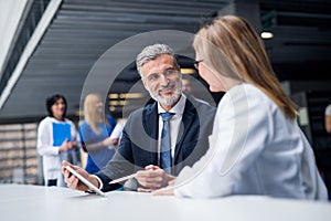 Doctor talking to a pharmaceutical sales representative.