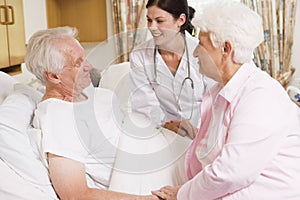 Doctor Talking To Senior Couple