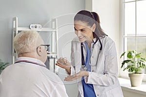 Doctor talks about benefits and prescribes hearing aid to elderly man who has become hard of hearing