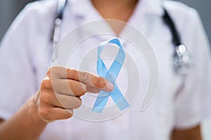 Doctor With Teal Ribbon Supporting Ovarian Cancer