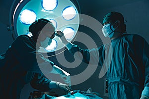 Doctor team hard working in operating room attempt to save patient life tried and exhausted
