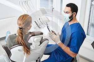 Doctor telling something to his female client