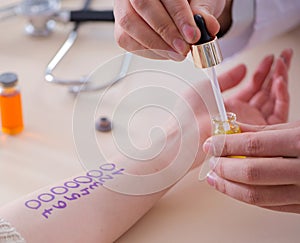 Doctor testing allergy reaction of patient in hospital