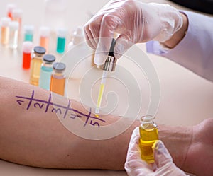 Doctor testing allergy reaction of patient in hospital