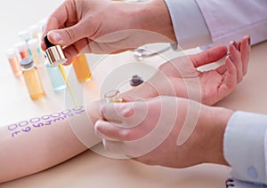 Doctor testing allergy reaction of patient in hospital