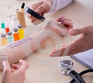 Doctor testing allergy reaction of patient in hospital