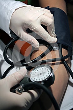 Doctor testing blood pressure
