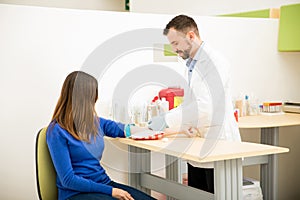 Doctor about to draw blood from patient