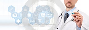 Doctor touch screen with a pen, medical symbols icons on background health care concept