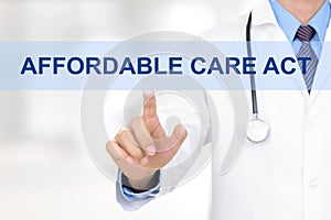 Doctor touching AFFORDABLE CARE ACT tab on virtual screen photo