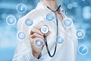 A doctor is touching a digital scheme of wireless connections containing small spheres with medical icons inside.The concept is