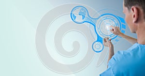 Doctor touching digitally generated icon