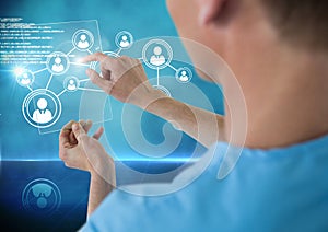 Doctor touching digitally generated icon