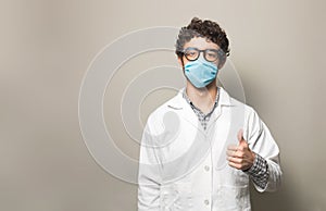 Doctor with tumb up and mask