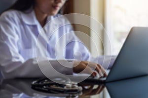 Doctor typing Computer, online medical learning concept