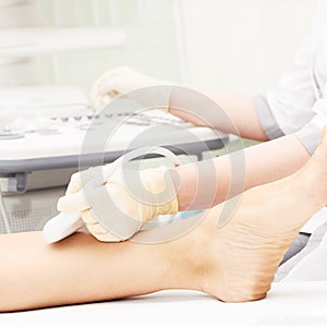 Doctor ultrasound knee test. Scan medical equipment. Diagnosis ultrasound foot