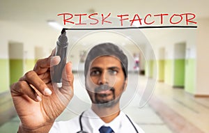 Doctor underlining close-up of risk factors
