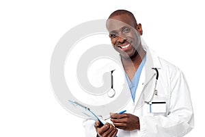 Doctor in a uniform holding a clipboard