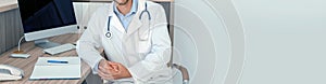 Doctor in uniform at workplace in clinic, space for text. Banner design photo