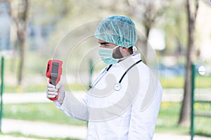 Doctor Use Infrared Thermometer to Check Body Temperature