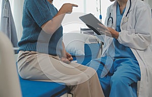 Doctor use stethoscope, checking up heart beat, lunch of auscultation in doctor office at hospital. Patient worker has to get