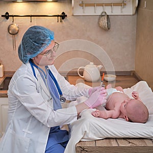 The doctor uses a syringe to inject a newborn child. A nurse in uniform is preparing to vaccinate a child