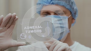 Doctor uses tablet with text Adnexal Tumors