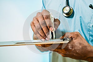 Doctor Using Calipers To Measure EKG photo