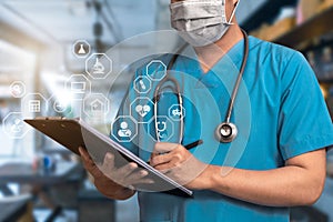 Doctor using clipboard and digital tablet find information patient medical history at the hospital.