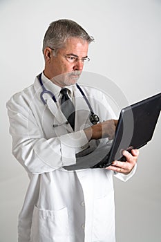 Doctor using computer vertical