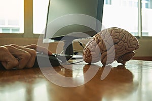 Doctor using desktop computer in medical office