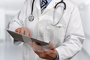 Doctor using digital tablet